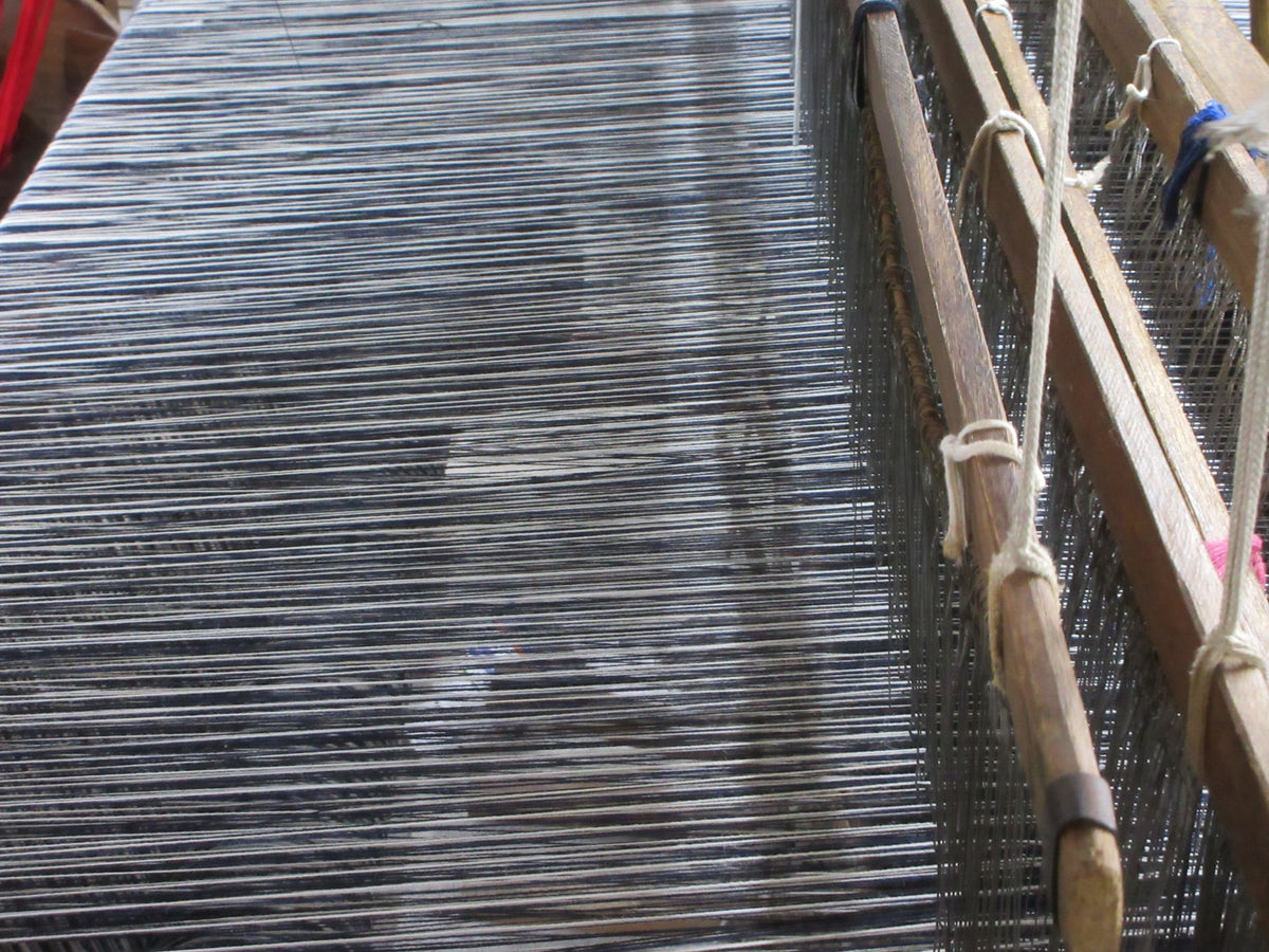 Warp threads on a wooden loom